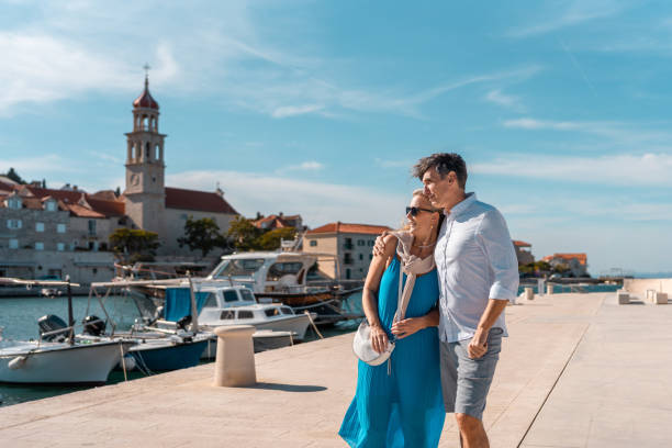 istock Mature Caucasian Couple Strolling Sutivan Harbor 2195461466