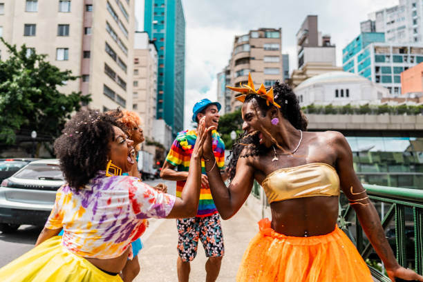 istock Friends doing high five at the street carnival 2195461624