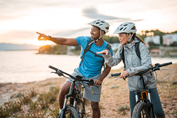 istock Active Sunrise Adventure by Seaside for Cycling Couple 2195462107
