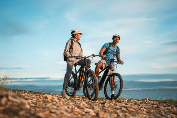 istock Diverse Cyclists Enjoying Adriatic Coastline at Dawn 2195462132
