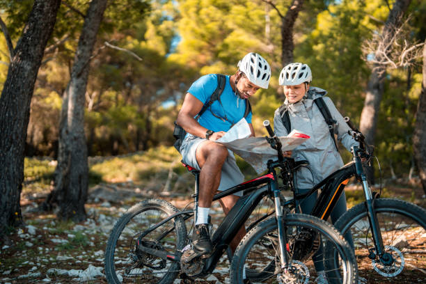 istock Outdoor Adventure Planning by Couple with E-Bikes 2195462242
