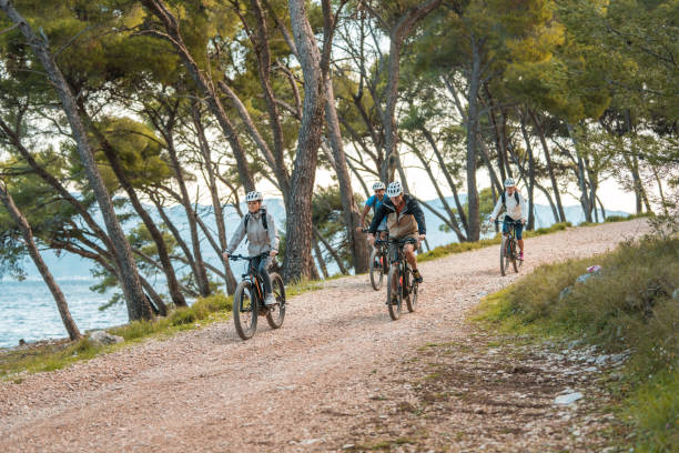 istock Diverse Group Cycling on Coastal Trail at Sunrise 2195462252