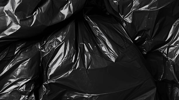 istock Black transparent plastic wrap texture overlay background. Realistic plastic for poster design and photo overlay effect. Wrinkled plastic surface pattern for graphic design sources and element mockup. 2195464077