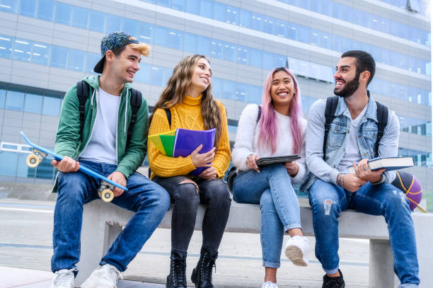 istock Group of multicultural students having fun at high school campus - Happy young people talking and laughing on city street - Guys and girls having fun outdoors - Educational and lifestyle concept 2195468682