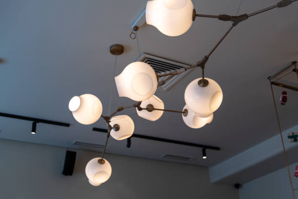 istock Unique lighting design hangs from the ceiling in a modern interior space during daytime hours 2195469483