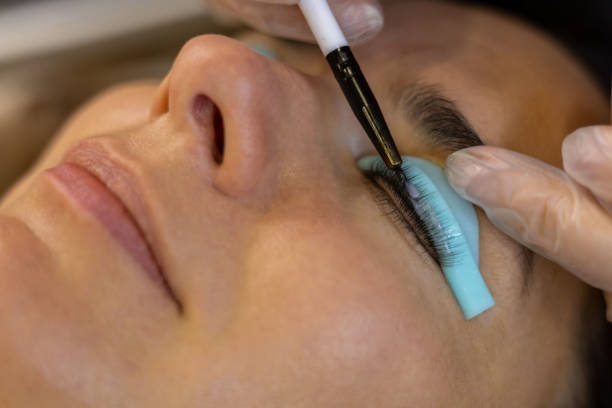 istock The make-up artist does eyelash lamination 2195469730