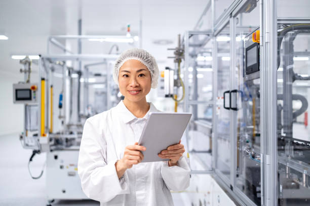 istock Production line worker in modern technology factory controlling manufacturing process. 2195469858