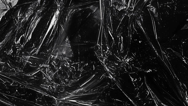 istock Black transparent plastic wrap texture overlay background. Realistic plastic for poster design and photo overlay effect. Wrinkled plastic surface pattern for graphic design sources and element mockup. 2195470666