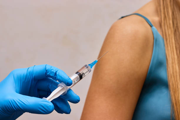 istock Vaccination concept. Vaccine syringe in doctor's hand. 2195478732