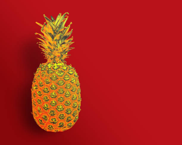 istock Abstract golden Pineapple on Red Background. Copy space 2195480059