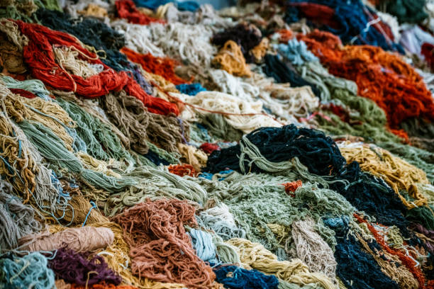 Colorful strands of yarn arranged intricately, showcasing the artistic craftsmanship of traditional weaving techniques. A visual celebration of fiber art, creativity, and the rich cultural heritage of traditional textile work.