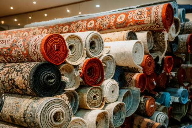 Stack of Vibrant Rolled Carpets in a Traditional Indian Rug Store