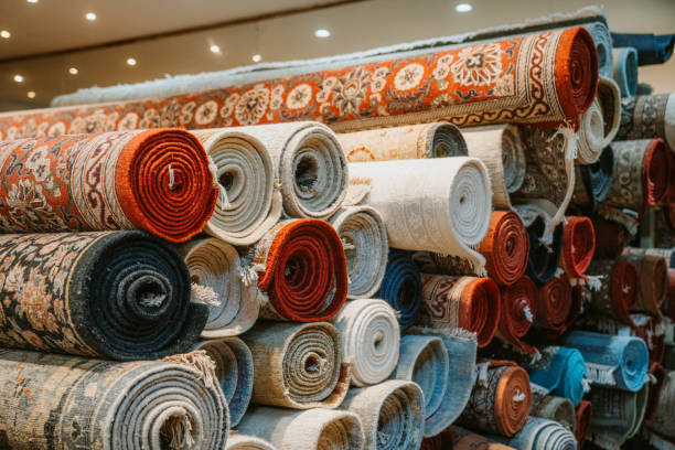 istock Collection of Rolled Up Traditional Indian Carpets in a Retail Setting 2195482480