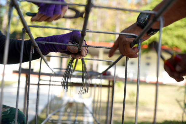 istock The hands of construction workers using using steel wire to bind steel bars Construction concept 2195488254