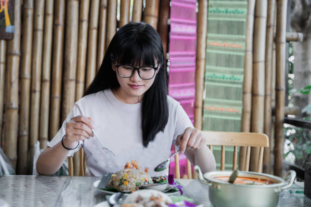istock A girl enjoying a meal 2195492862