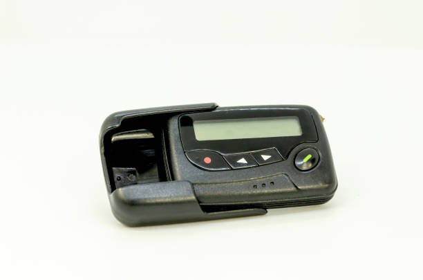 istock pager in close-up, an old retro communication device on white background 2195495015