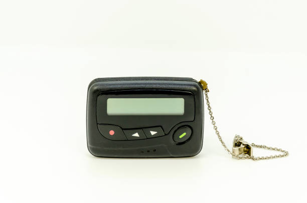 istock pager in close-up, an old retro communication device on white background 2195495024