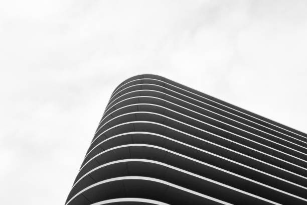 istock Modern Architectural Design: Minimalist Curved Building Facade against Sky 2195495555