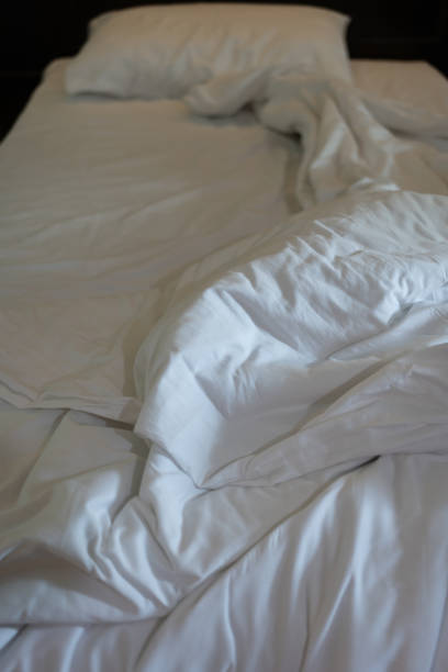 istock Empty bedroom, pillow, blanket and white linen after wake up. 2195496385