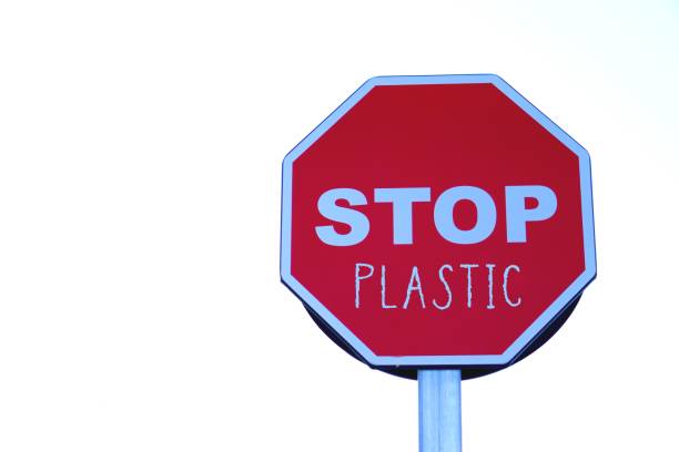 istock stop plastic. environmental activism concept. words written on a highway stop sign. 2195496493