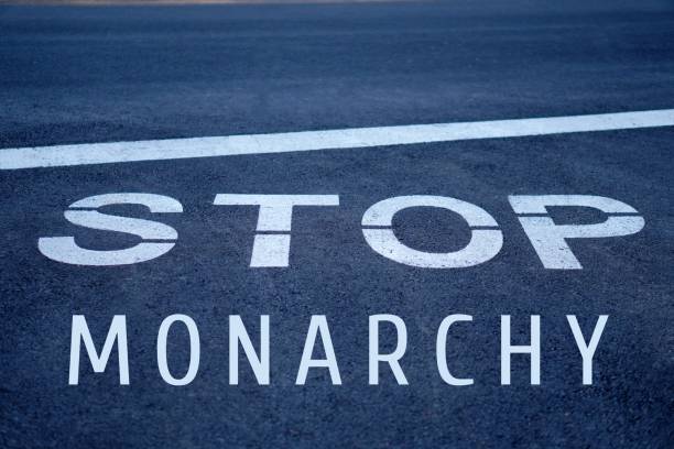 istock stop monarchy. monarchy and republic concept. words written on a highway stop sign. 2195496504
