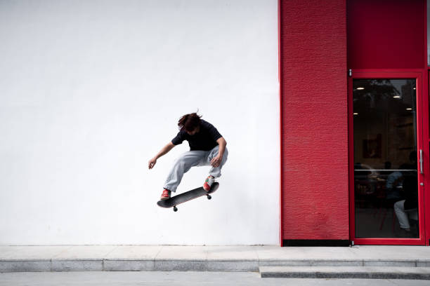 istock Teenagers skateboarding together 2195497959