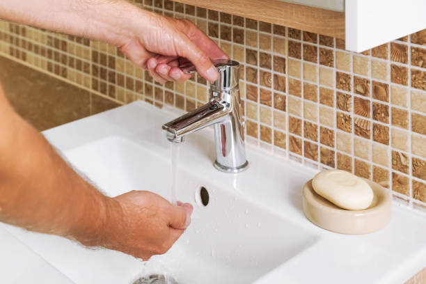istock man use soap to wash your hands in the bathroom 2195501178