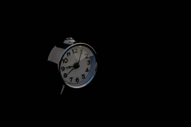 Classic Old Collectible Alarm Clock on Black Background with Space for your Text.