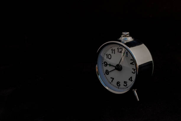 Minimalist Side View of Vintage Alarm Clock with Space for text