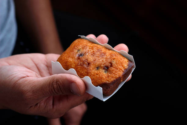 istock biscuit in hand, sweet biscuit in palms, nutrition concept 2195510274