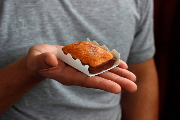 istock biscuit in hand, sweet biscuit in palms, nutrition concept 2195510330
