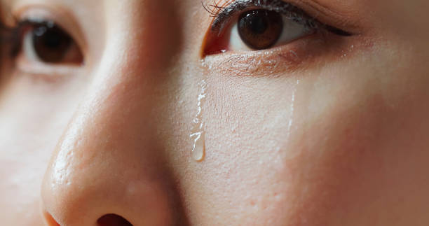 istock tears rolling down woman eye 2195513433