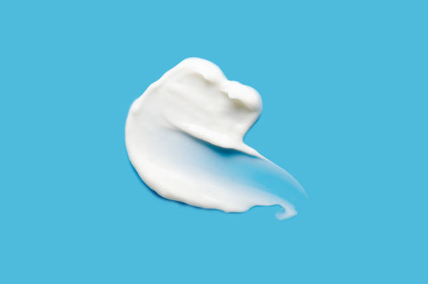 istock A sample of white cosmetic moisturizer on a blue background 2195513971