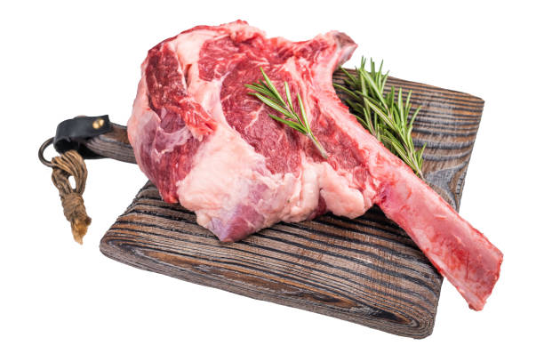 istock Raw Tomahawk beef steak, fresh black angus ribeye with bone on wooden board Isolated on a white background. top view 2195518858
