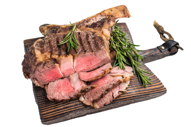 istock BBQ fried Tomahawk beef steak, grilled marbled rib eye with bone on wooden board isolated on white background. top view 2195518886