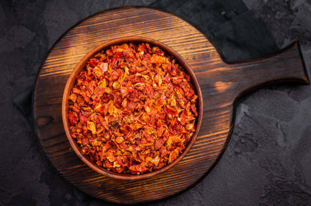 istock Dried and chopped Tomato for cooking. black background. top view 2195519037