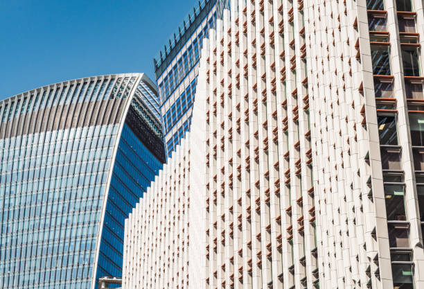 Close up of contrasting modern architectural detail on a sunny day in the City of London, including the 20 Fenchurch Street building at the left.