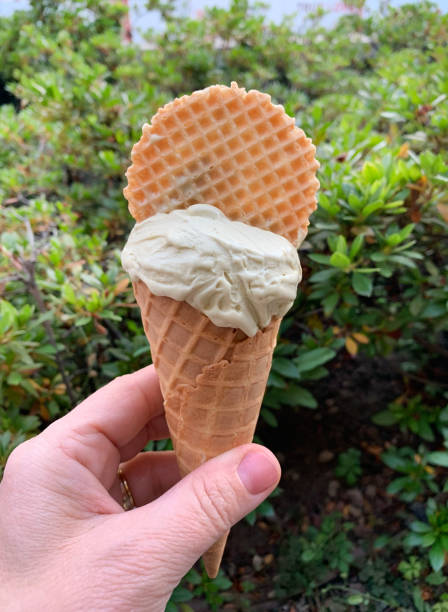 istock Woman holding an ice cream cone. 2195520210