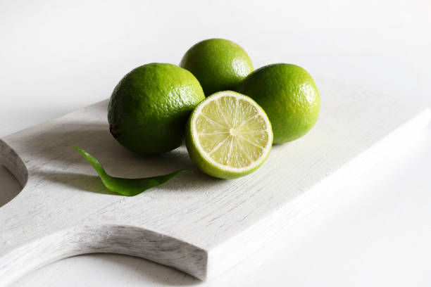 Citrus fruits on a cutting board with copy space.
