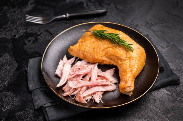 istock Traditional Smoked chicken leg, poultry meat on plate. black background. top view 2195521985