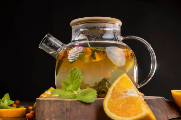 istock tea with orange and ripe sea buckthorn berries 2195522275