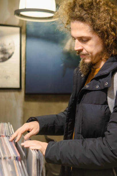 istock Buying a analogue record at a garage sale 2195523209