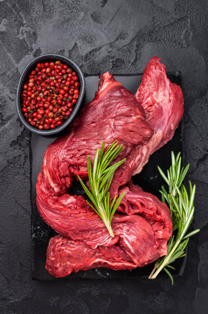 istock Raw Beef Machete Steak, also name Skirt steak, fresh marble meat. black background. top view 2195523263