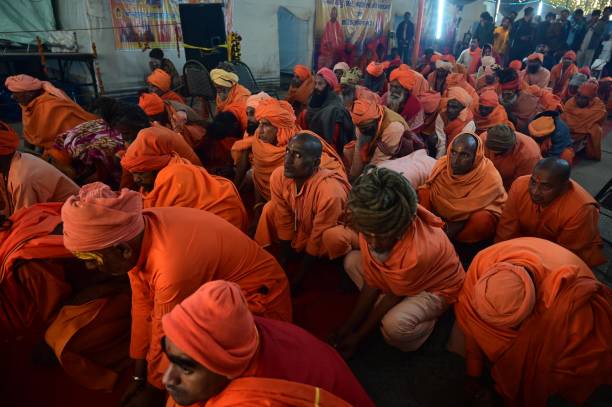 Prayagraj: Sadhus of 'Shri Taponidhi Anand Akhara' take part in evening ritual during ongoing Mahakumbh mela at Sangam in Prayagraj on Thursday, Jan. 23, 2025.