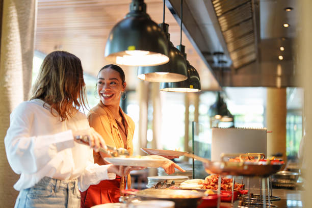 istock Diverse Young Females Enjoying Self-Service Restaurant 2195526267