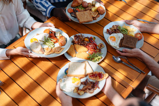 istock Diverse Group Enjoying Hearty Outdoor Breakfast 2195526268