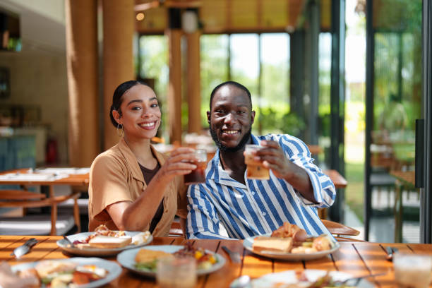 istock Cheerful Multiracial Friends Enjoying Breakfast Together 2195526308