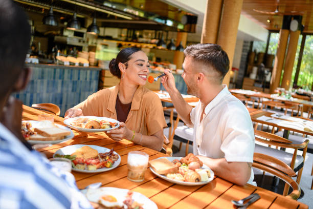 istock Joyful Multiracial Friends Sharing Breakfast in Cozy Cafe 2195526396