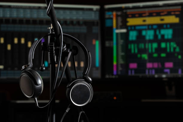 istock Headphones hanging in a music production studio 2195532183