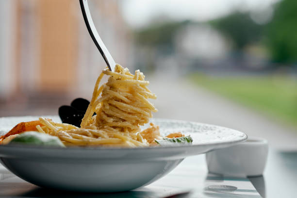 Fork Twirling Creamy Seafood Spaghetti.